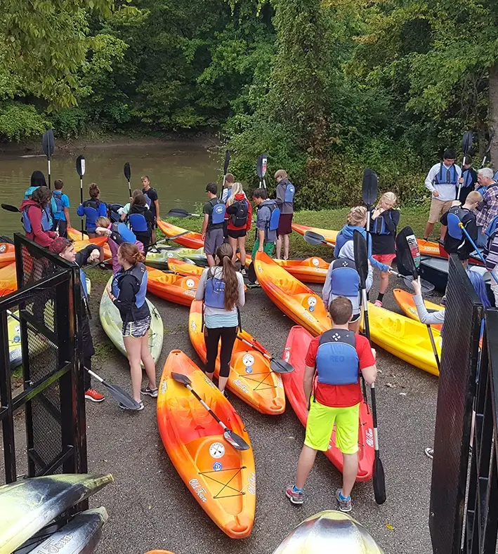 Kayakers enjoying a self-guided paddle on the Little Miami River during a kayak rental trip near Waynesville, Ohio.